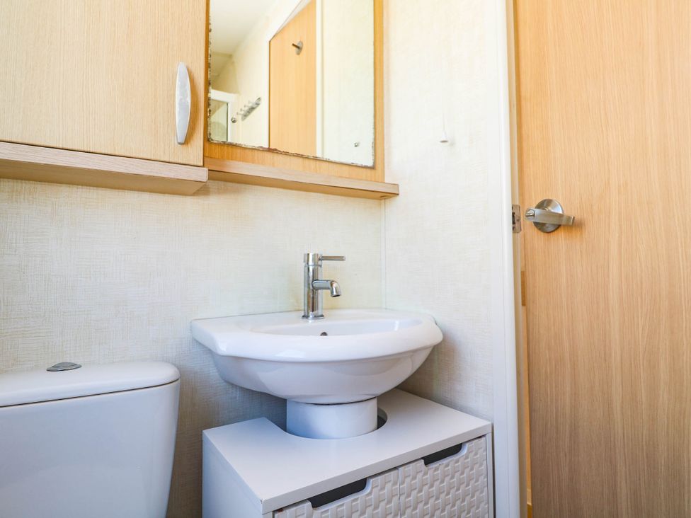 A bathroom with a sink and toilet at No.73 Sennen Cove