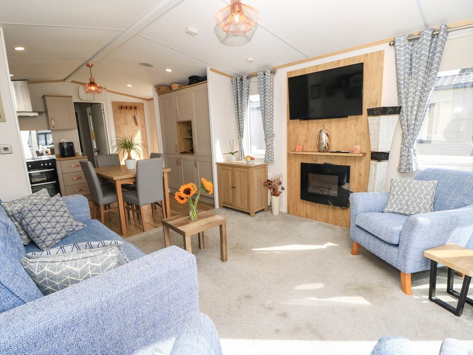 A living room with a sofa and fireplace at 216 Solent Breezes Southampton