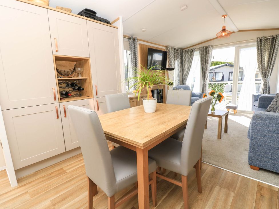 A dining room with a table and chairs at 216 Solent Breezes in Southampton