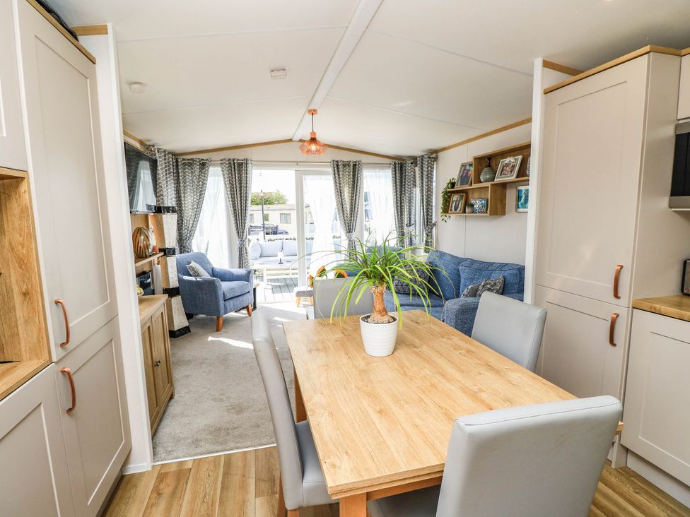A dining room with a table and chairs at 216 Solent Breezes in Southampton