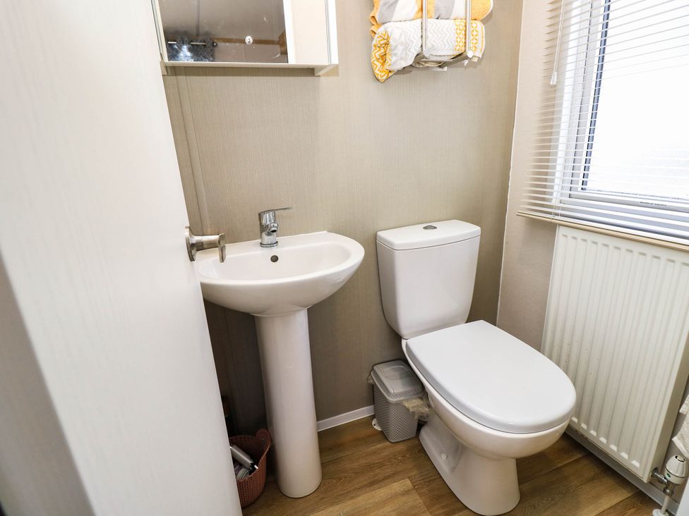 A bathroom with a sink and toilet at 216 Solent Breezes in Southampton
