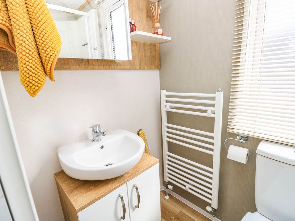 A bathroom with a sink and toilet at 216 Solent Breezes Southampton