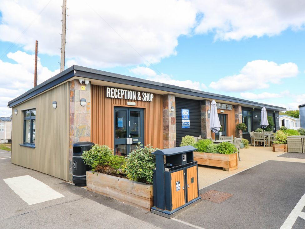 A reception and shop building with seating areas at 216 Solent Breezes Southampton