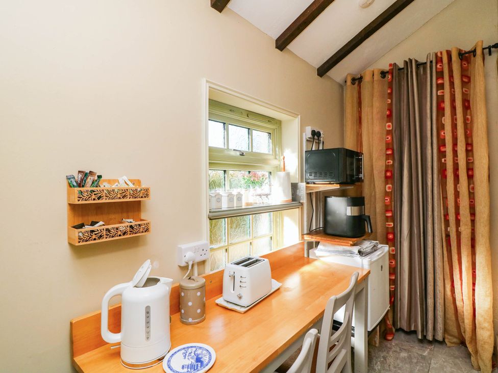 A kitchen with appliances on a table at Kate’s Daingean