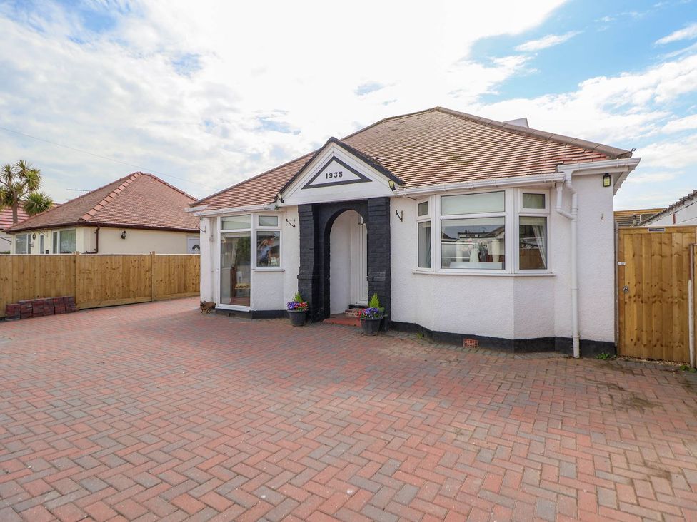 A house with a front yard and driveway at Brimrod Talacre