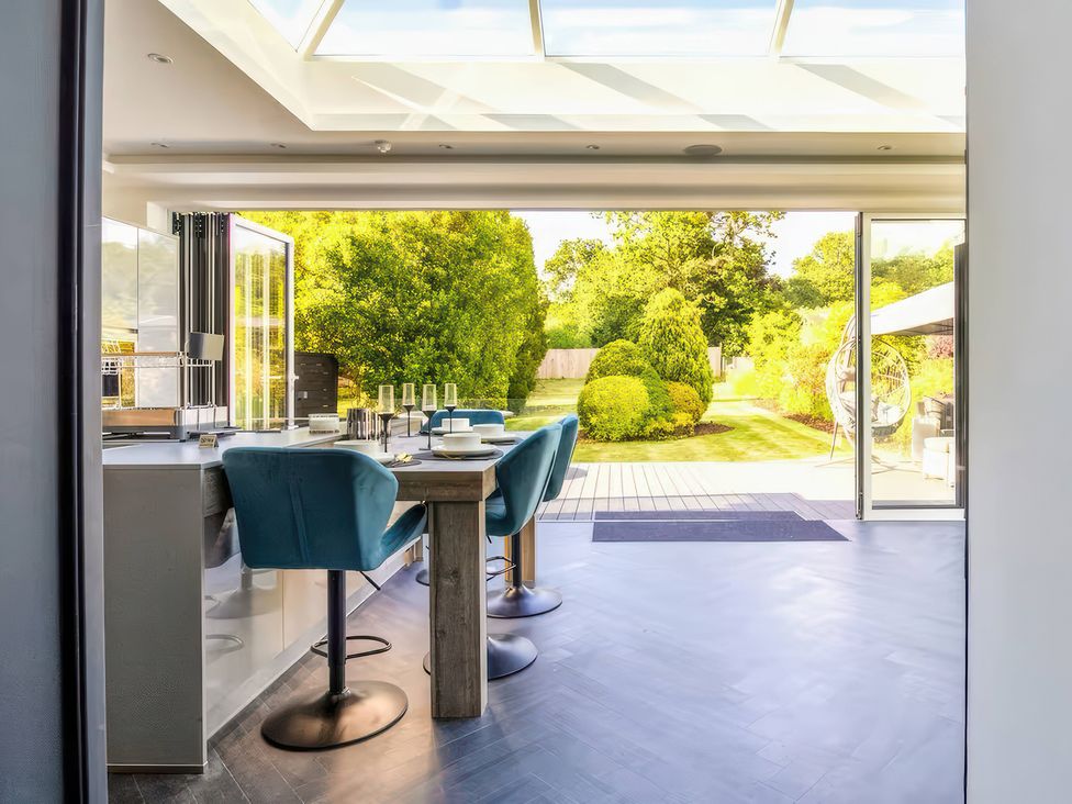 A kitchen with a view of the garden at 19 Hillside Road Northwood, Hertfordshire