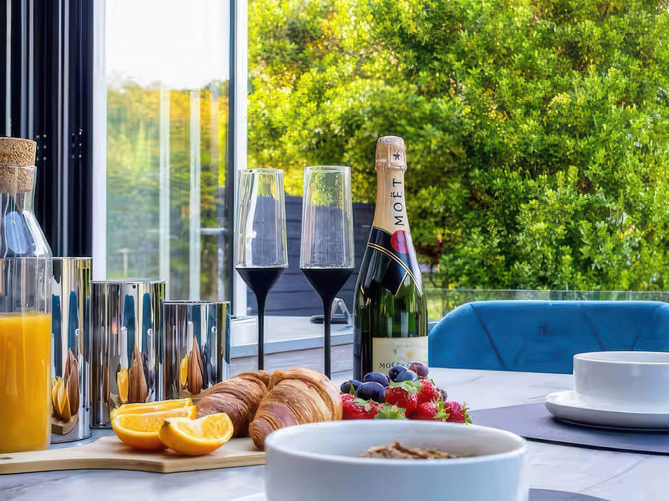 An outdoor dining area with drinks and pastries at 19 Hillside Road, Northwood, Hertfordshire