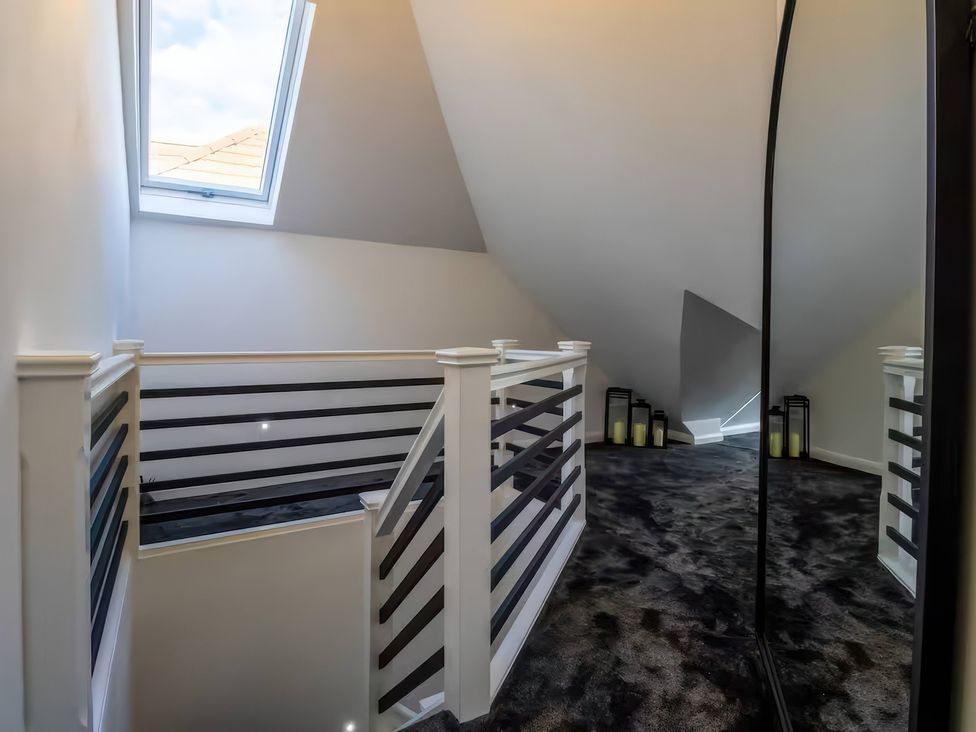 A landing with a skylight and candles at 19 Hillside Road, Northwood, Hertfordshire