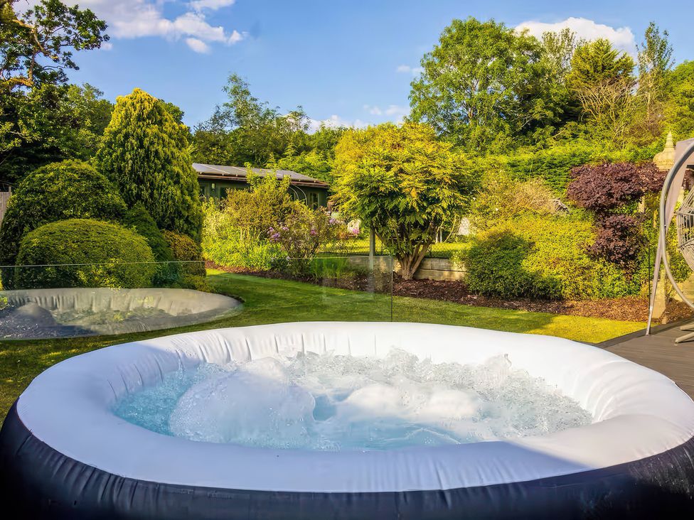 A hot tub in a garden at 19 Hillside Road Northwood Hertfordshire