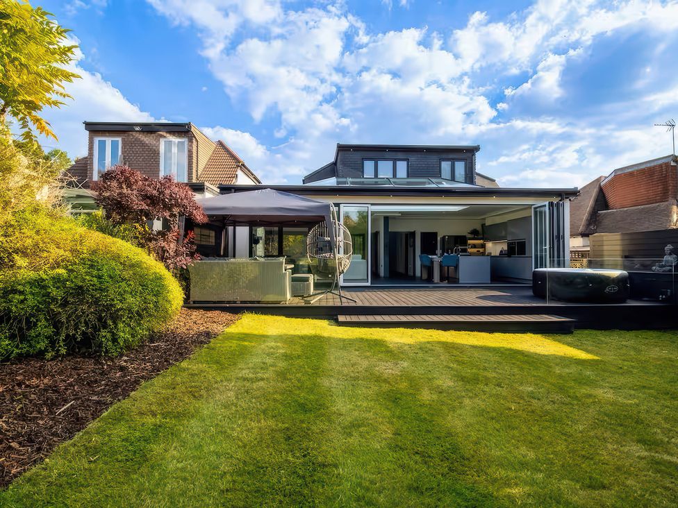 A house with a garden and deck at 19 Hillside Road Northwood, Hertfordshire