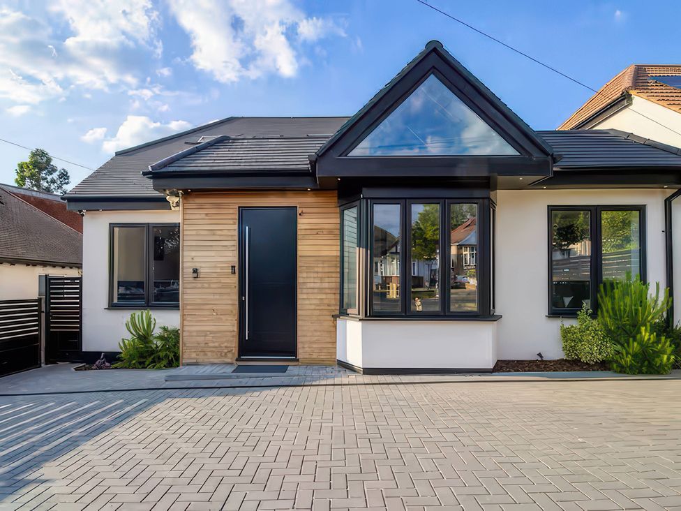 A house with a front door and windows at 19 Hillside Road in Northwood, Hertfordshire