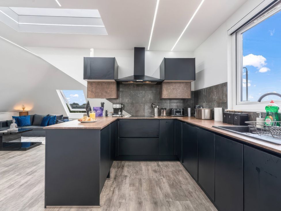 A kitchen with cabinets and countertop at Flat 6, Hilltop Court in Uxbridge