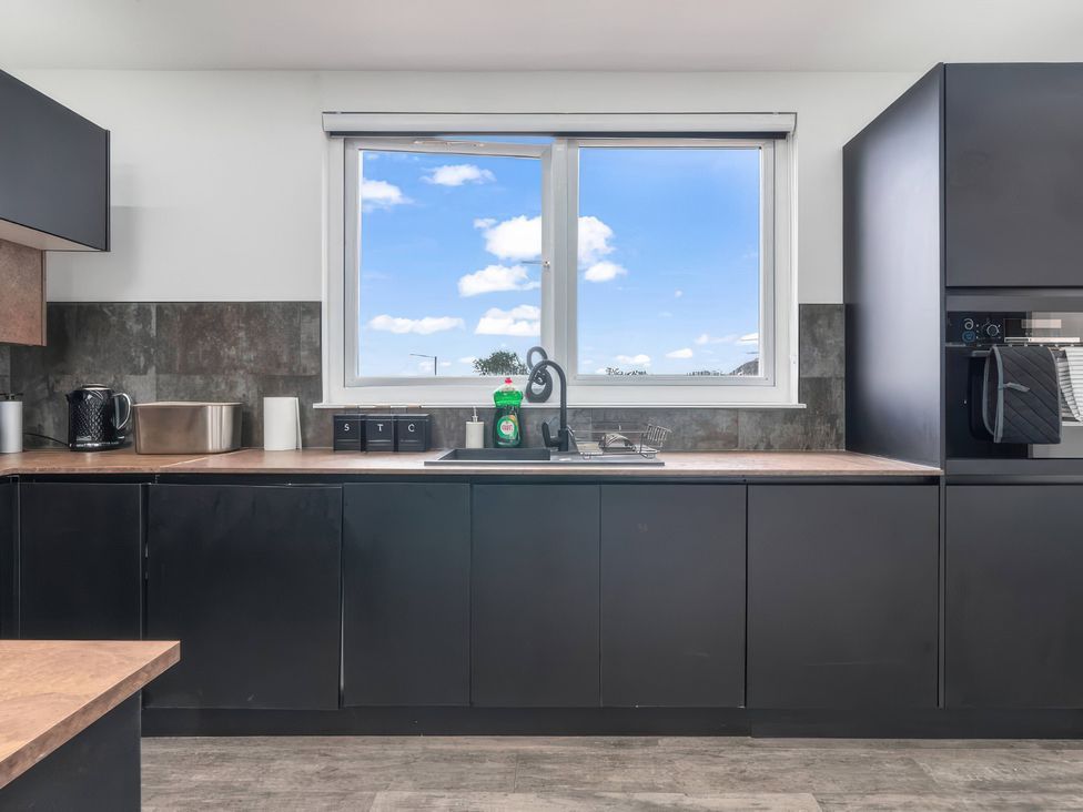 A kitchen with sink and cabinets at Flat 6, Hilltop Court in Uxbridge