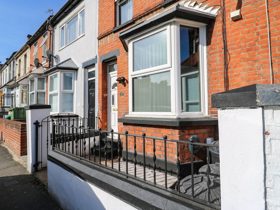 An exterior view of a terraced house with a fence at Gillingham House in Gillingham, Kent