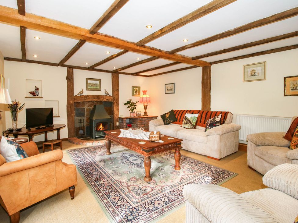 A living room with sofa and television at The Duck House at Hyssington Farm near Montgomery