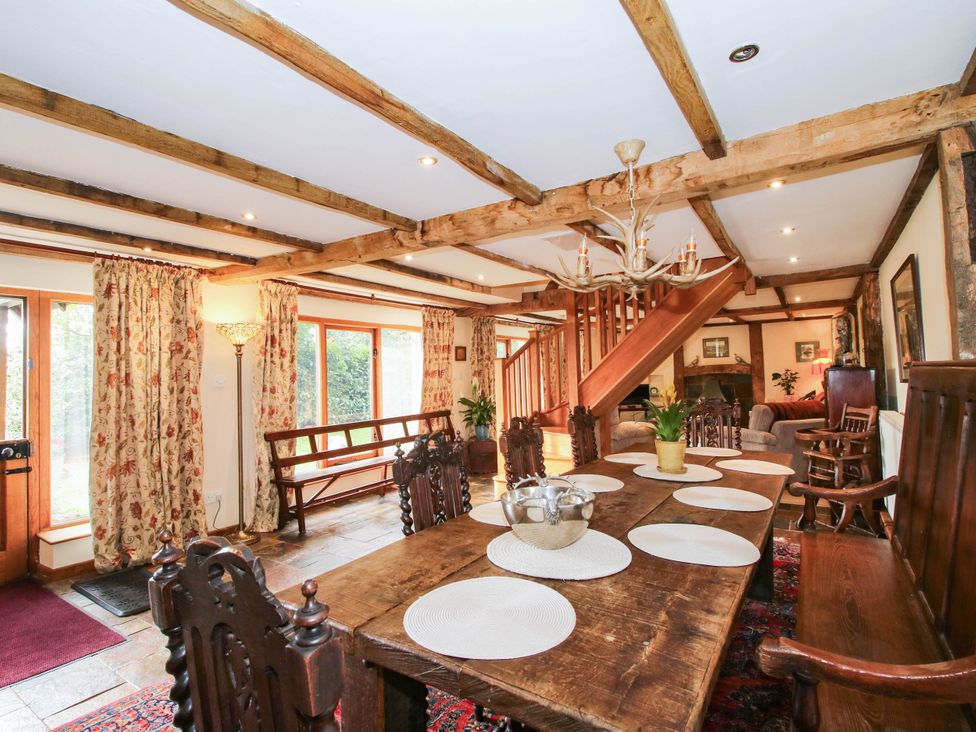 A dining room with a table and chairs at The Duck House at Hyssington Farm near Montgomery