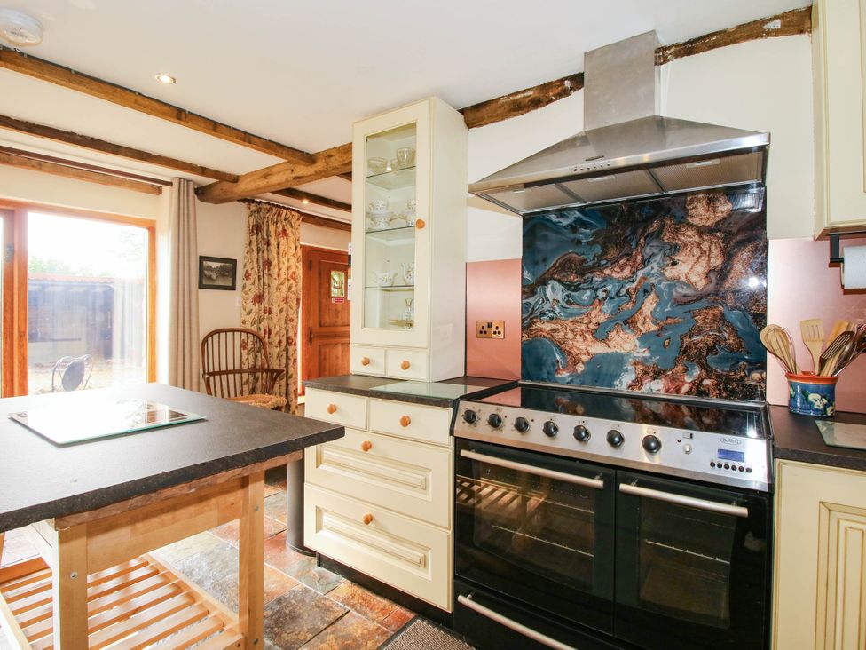 A kitchen with an oven and countertop at The Duck House at Hyssington Farm near Montgomery