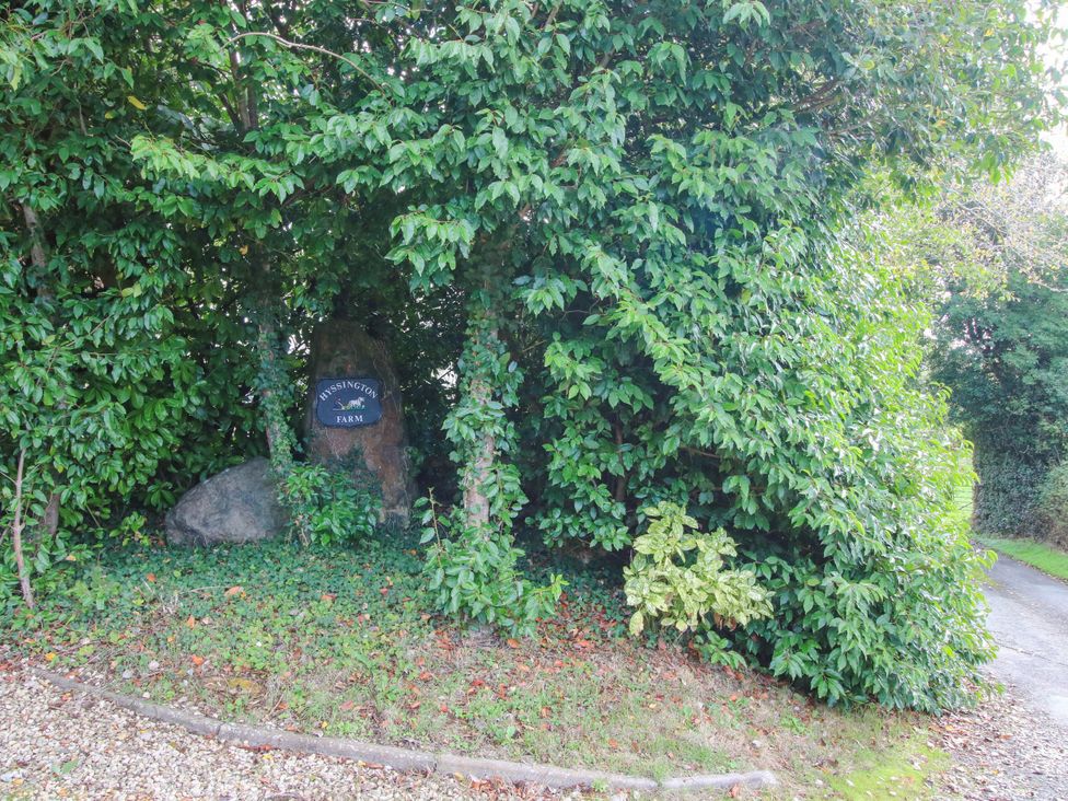 A sign for Hyssington Farm near a path at The Duck House at Hyssington Farm near Montgomery