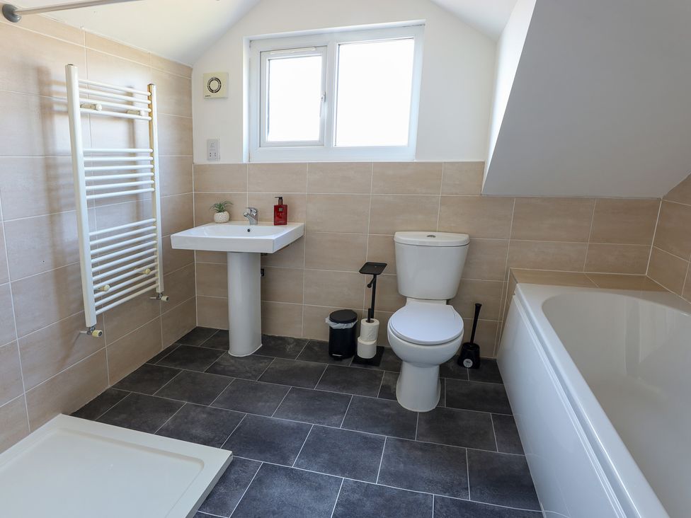 A bathroom with a sink and toilet at 5 Woodland Crescent in Manchester