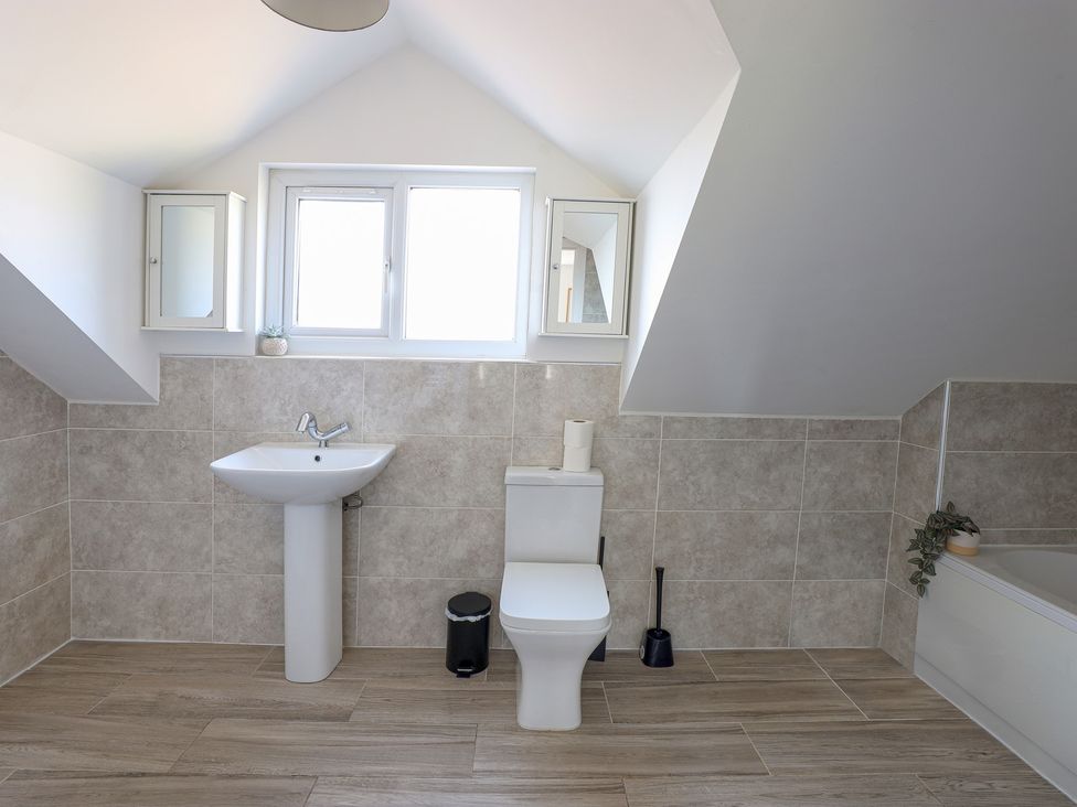 A bathroom with sink and toilet at 5 Woodland Crescent in Manchester