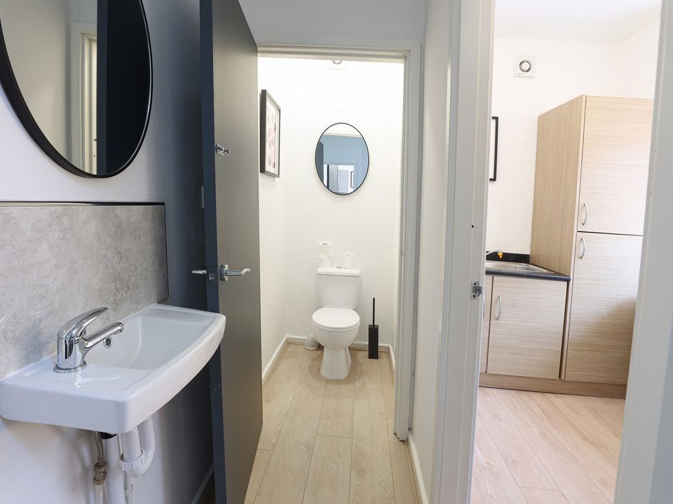 A bathroom with a sink and toilet at 5 Woodland Crescent in Manchester
