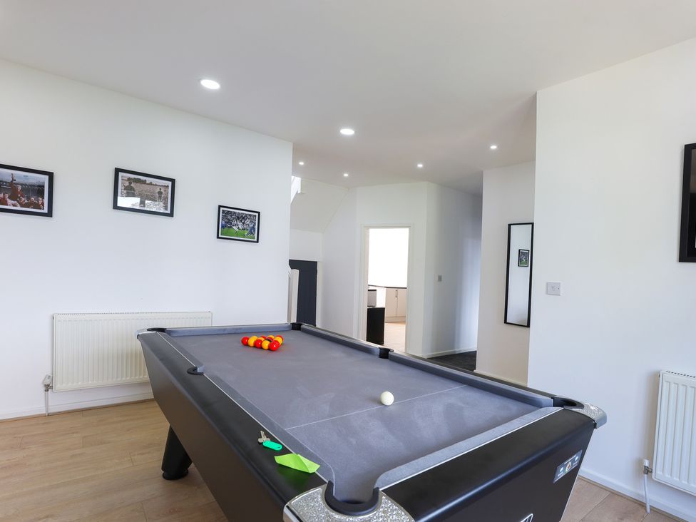 A game room featuring a pool table with balls and wall photos at 5 Woodland Crescent Manchester