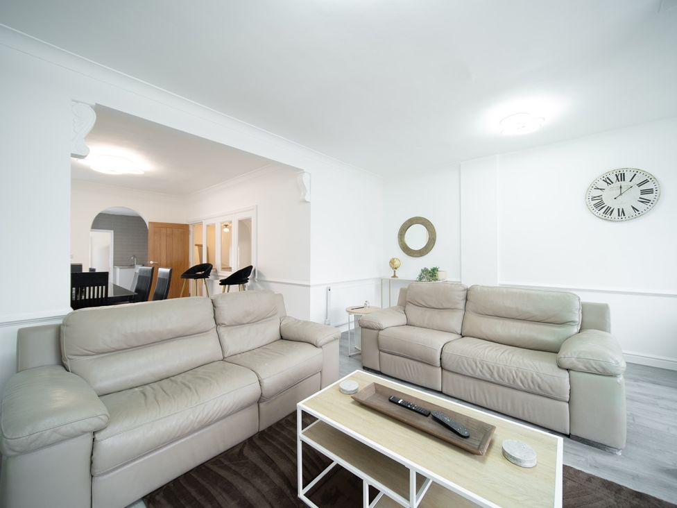 A living room with sofas and a coffee table at Spacious Duplex Flat Thornton-Cleveleys