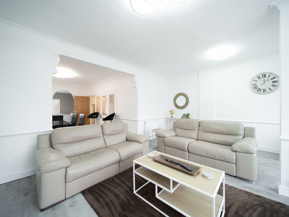 A living room with sofas and a coffee table at Spacious Duplex Flat in Thornton-Cleveleys