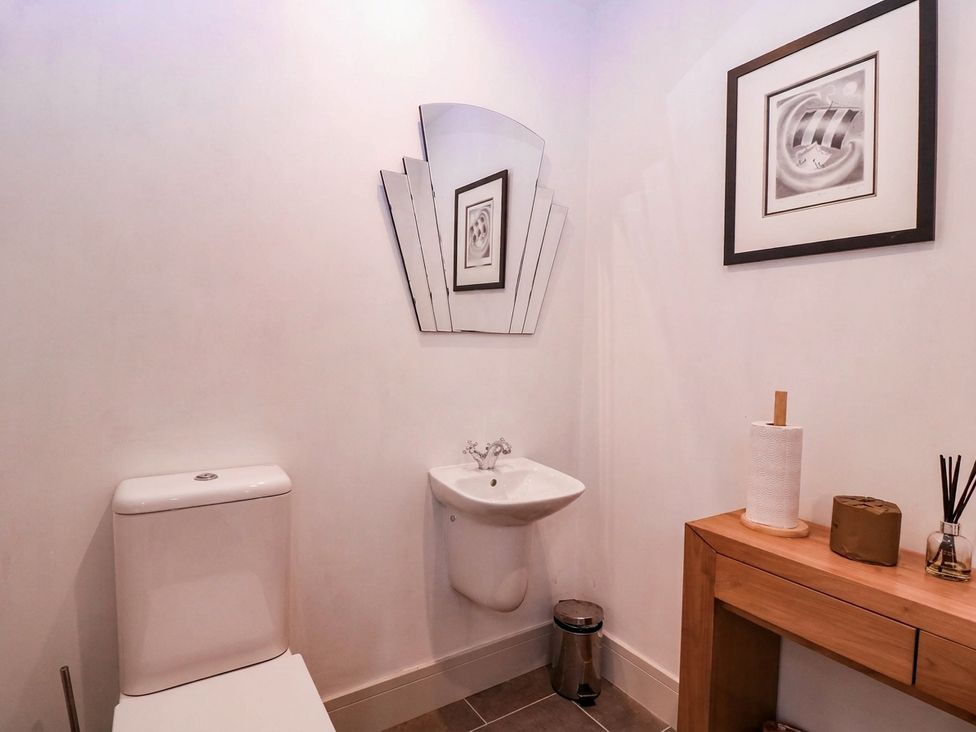 A bathroom with a toilet and hand basin at Hanbury House in Lea