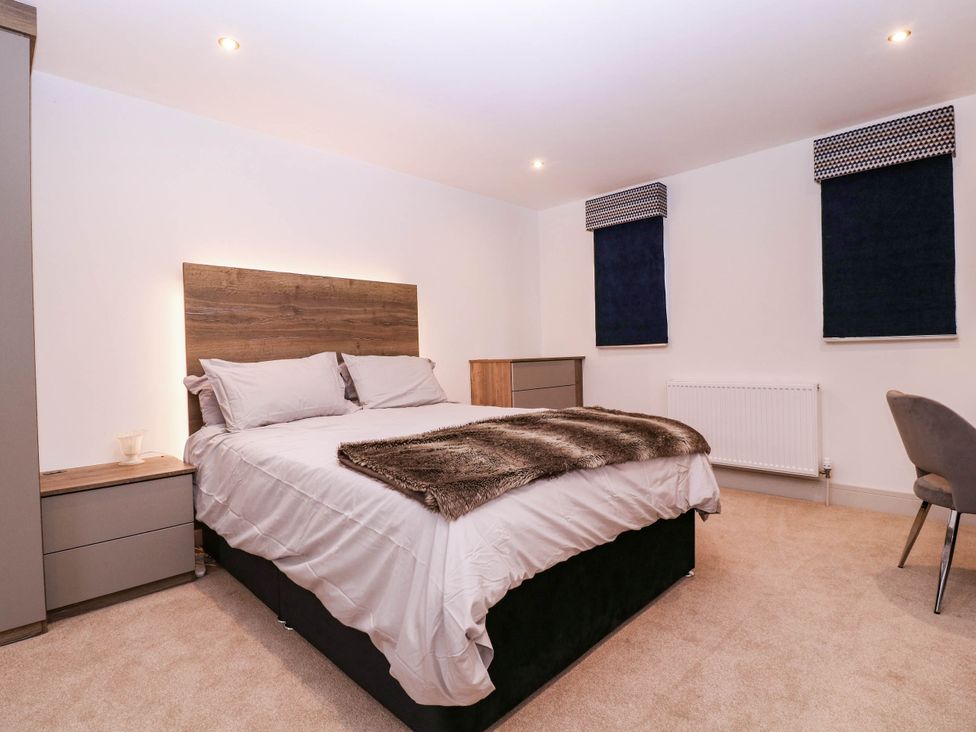 A bedroom with a bed and a dresser at Hanbury House in Lea