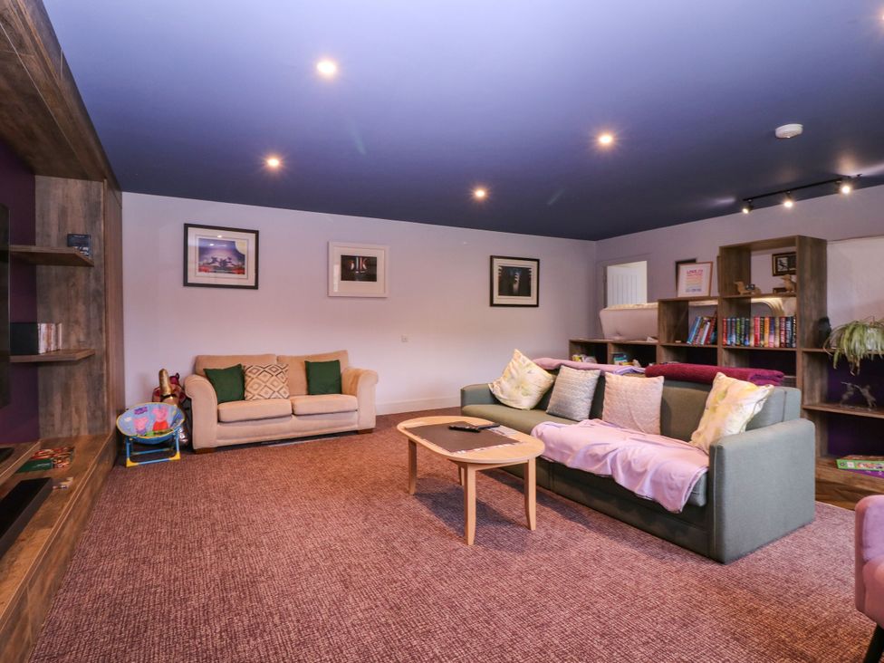 A living room with a sofa and coffee table at Hanbury House in Lea