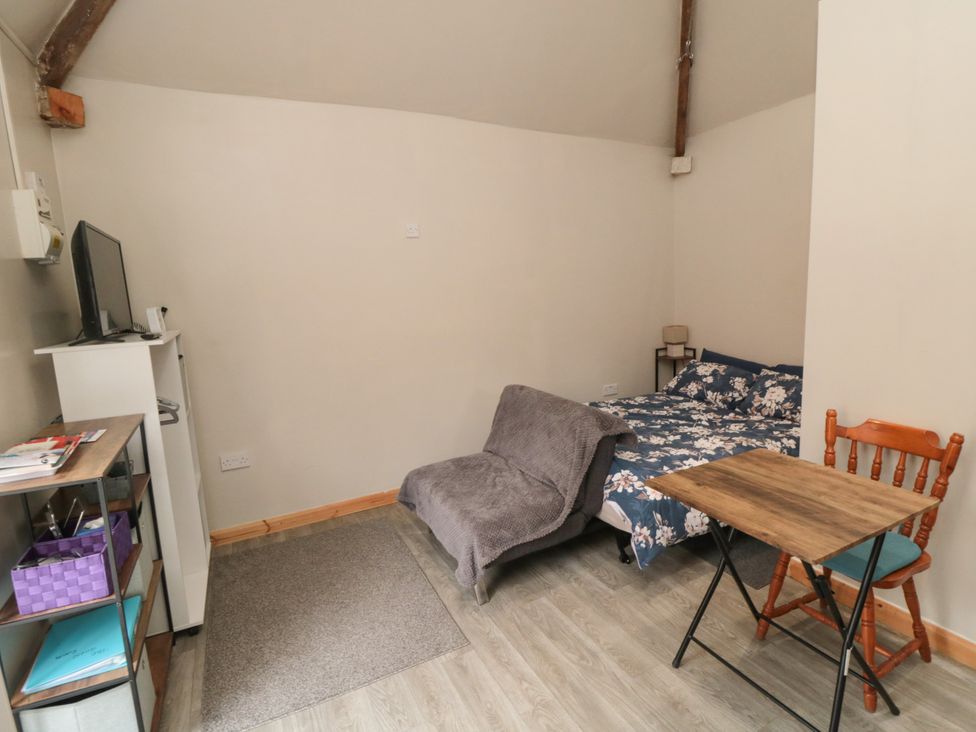 A guest room with a bed, table, and chair at The Guest Room in Redcar