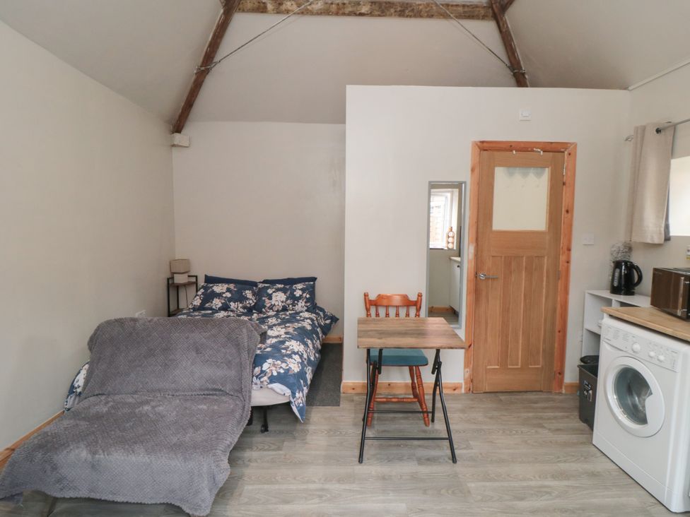 A studio apartment with a bed and kitchen facilities at The Guest Room in Redcar