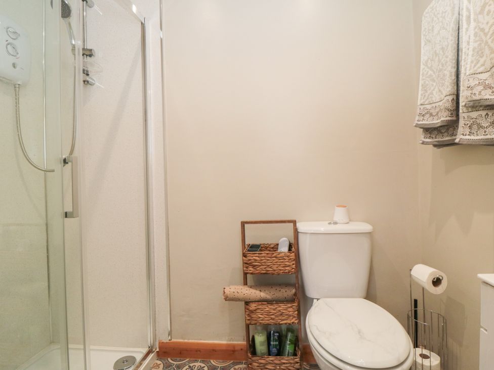 A bathroom with a shower and a toilet at The Guest Room in Redcar