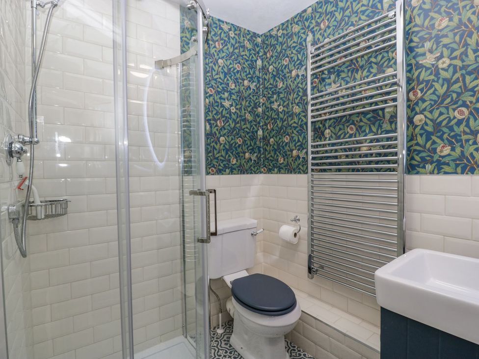 A bathroom with a shower and toilet at Kylemore in Glastonbury