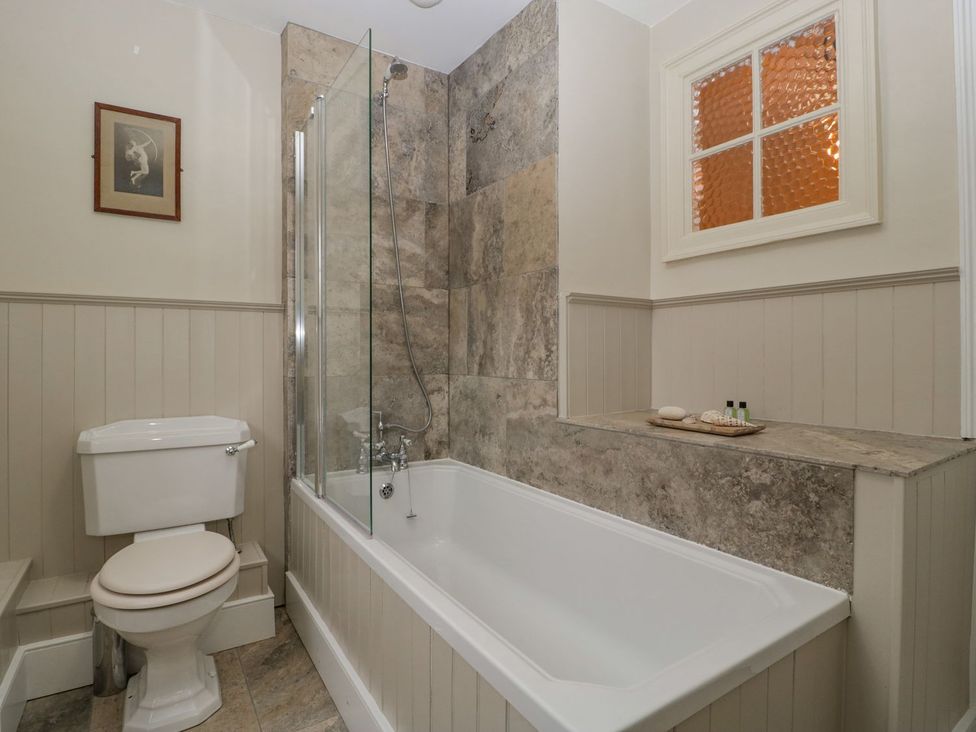A bathroom with a bathtub and shower at Kylemore in Glastonbury