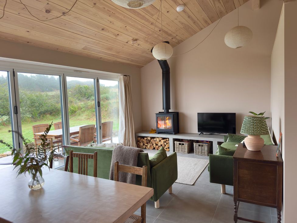 A living room with a sofa and fireplace at Granfer’s near Penryn