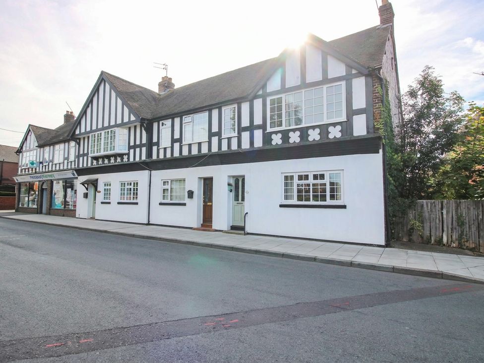 A building with multiple windows and a door at 3 Jubilee Cottages Pontesbury