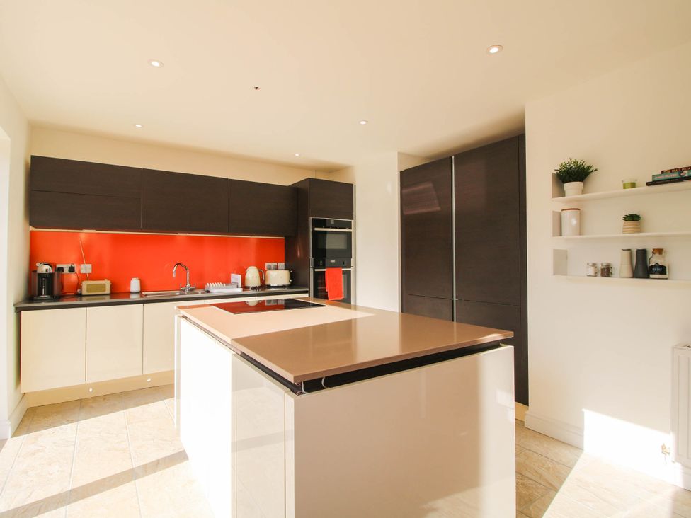 A kitchen with countertops and appliances at 3 Jubilee Cottages Pontesbury