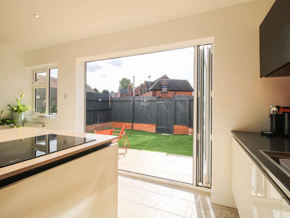 A kitchen with a view of the garden at 3 Jubilee Cottages Pontesbury