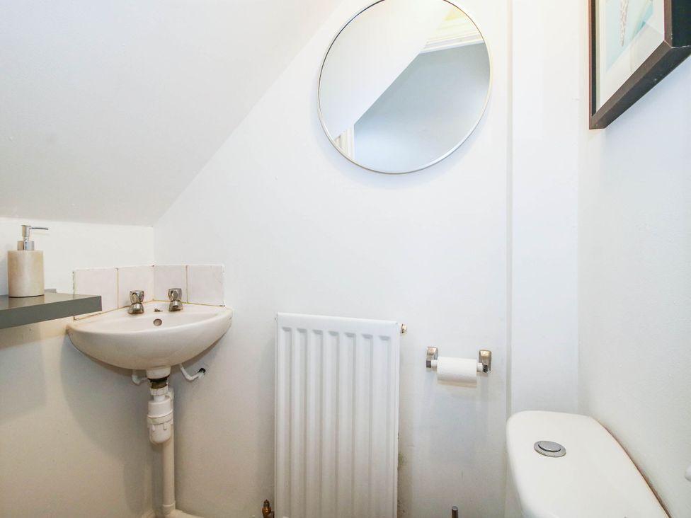 A bathroom with a sink and toilet at 3 Jubilee Cottages in Pontesbury
