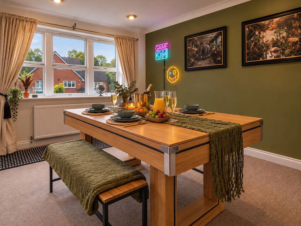 A dining room with table set for a meal at 20A Westend Parade in Gloucester