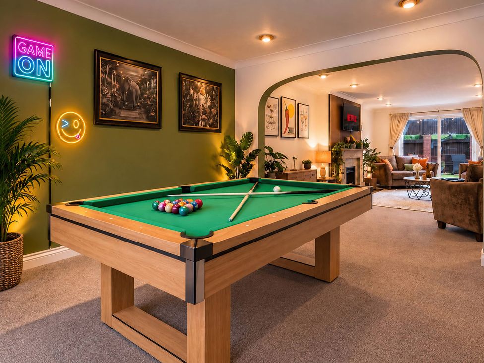 A game room with a pool table and a couch at 20A Westend Parade in Gloucester