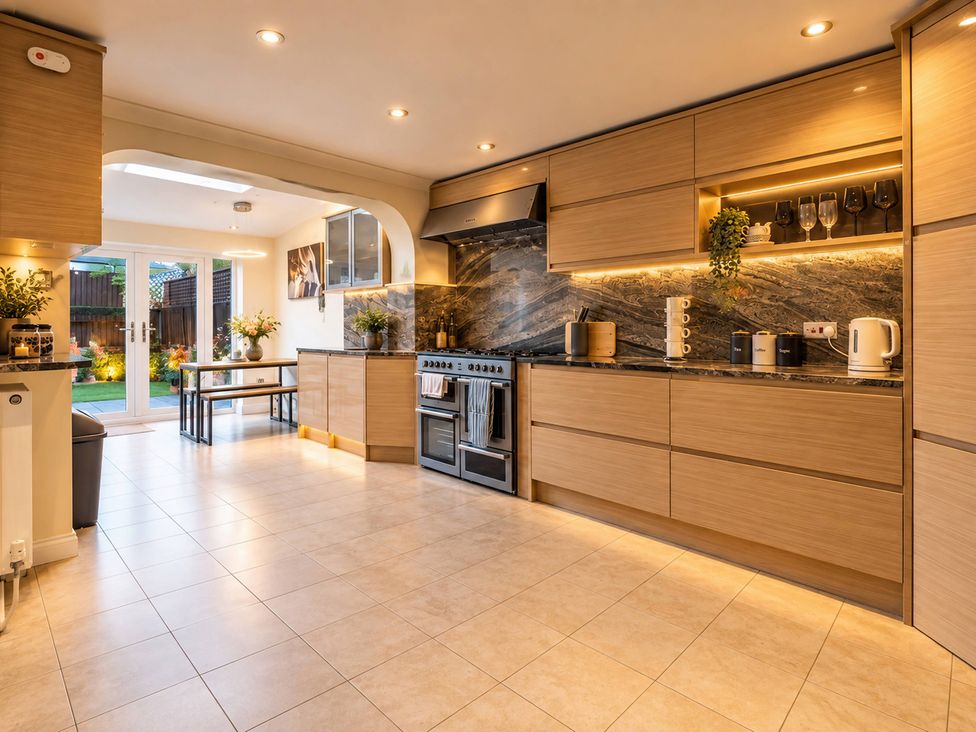 A kitchen with a stove and sink at 20A Westend Parade in Gloucester