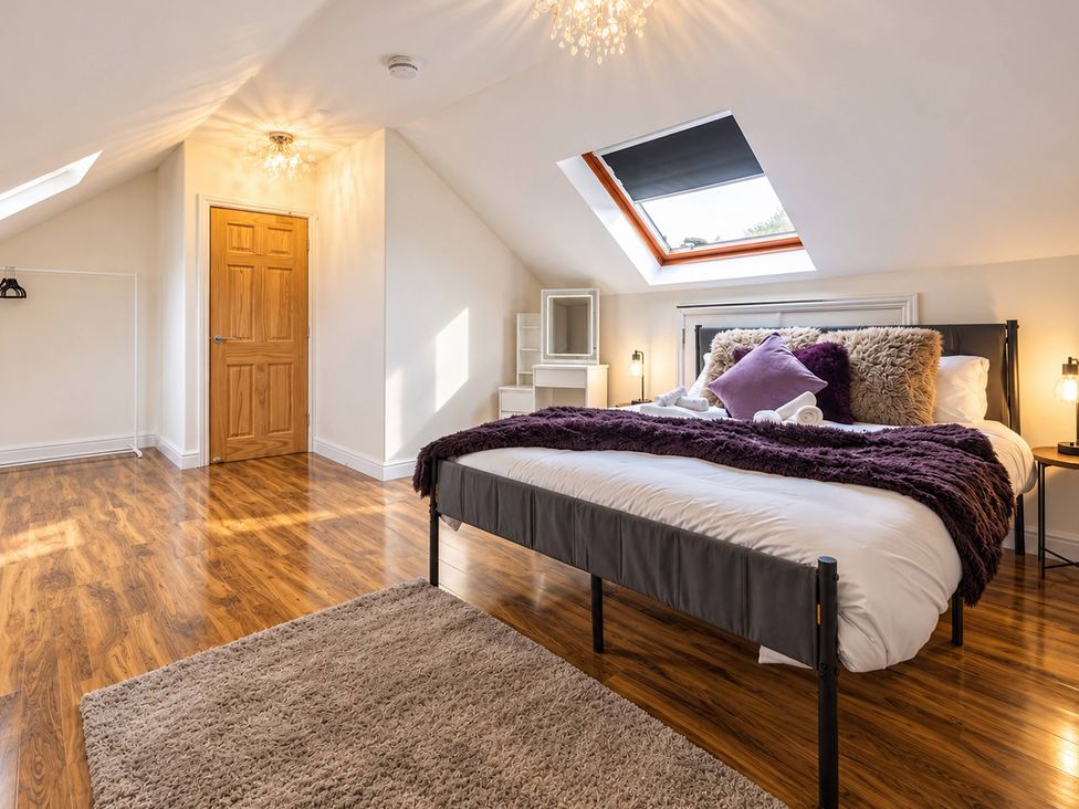 A bedroom with a bed and a storage unit at 20A Westend Parade in Gloucester