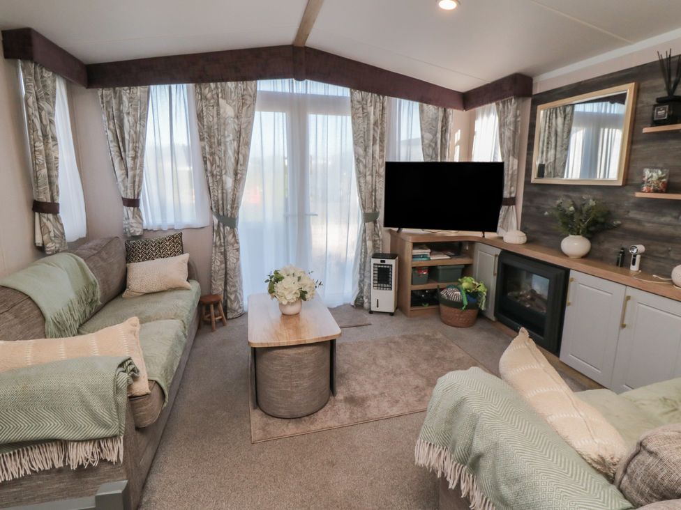 A living room with sofa and television at 19 Finch