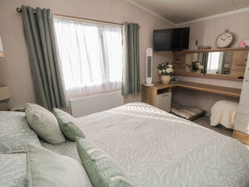 A bedroom with a bed and desk at 19 Finch