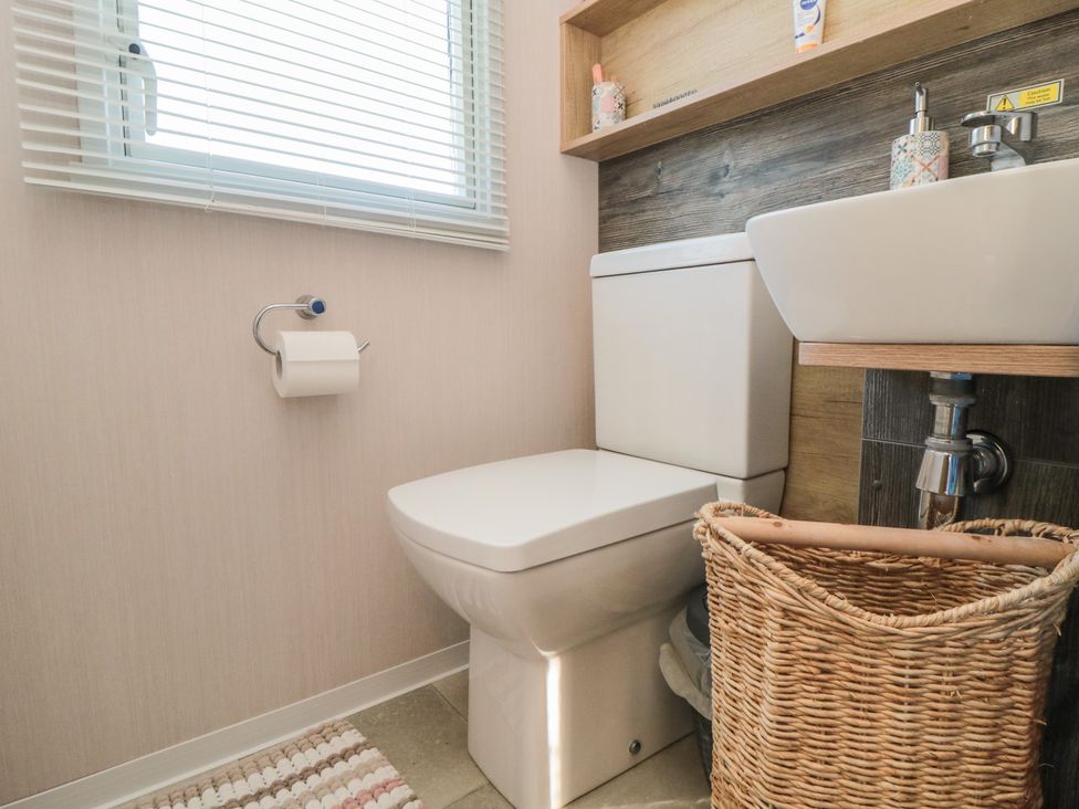 A bathroom with a toilet and sink at 19 Finch