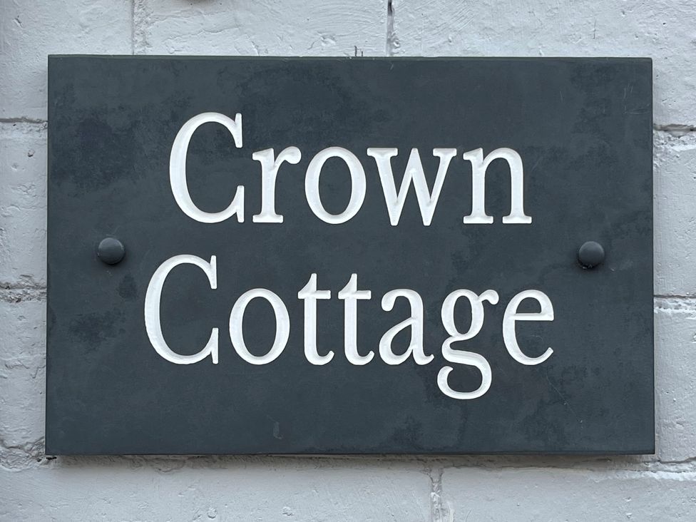 A sign with the name Crown Cottage in Appleby-in-Westmorland