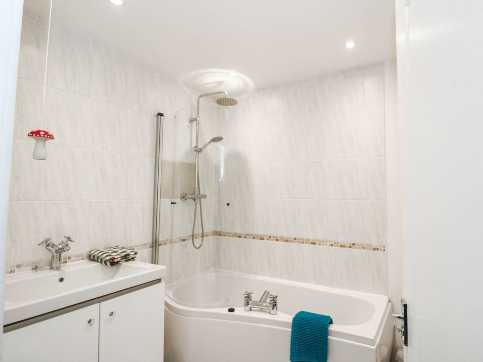 A bathroom with a bathtub and shower at Moness Garden Studio Aberfeldy